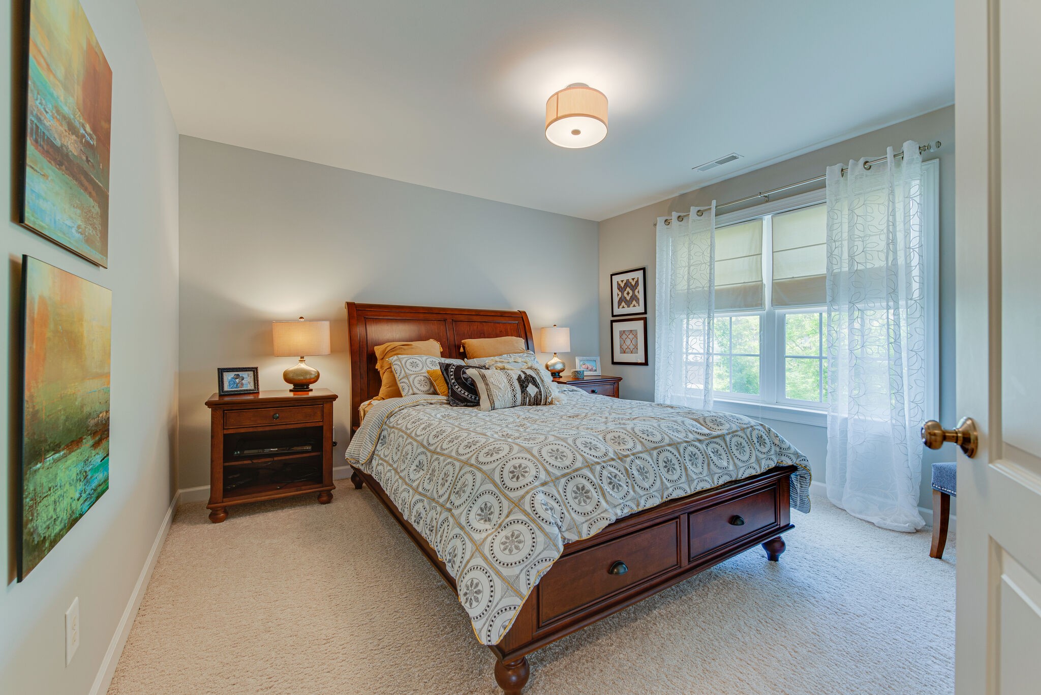 1027 Red Pepper Ridge Spring Hill, TN 37174 - Photo 25 of 38 a bed sitting in a bedroom next to a window