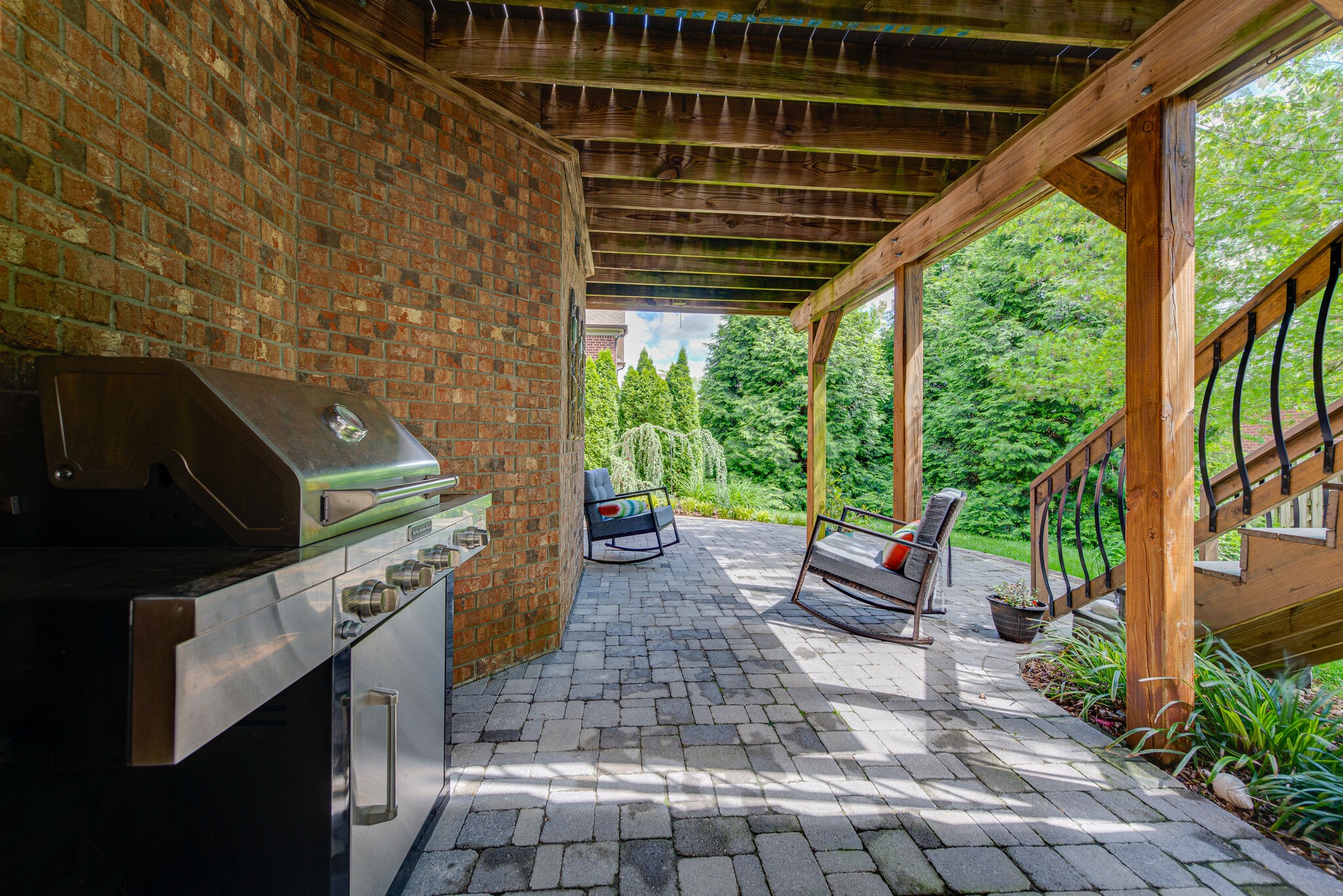 1027 Red Pepper Ridge Spring Hill, TN 37174 - Photo 32 of 38 a backyard of a house with a swing table and chairs