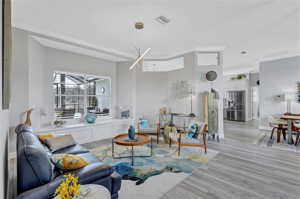 8409 29th Street East Parrish, FL 34219 - Photo 11 of 65 a living room with furniture and wooden floor