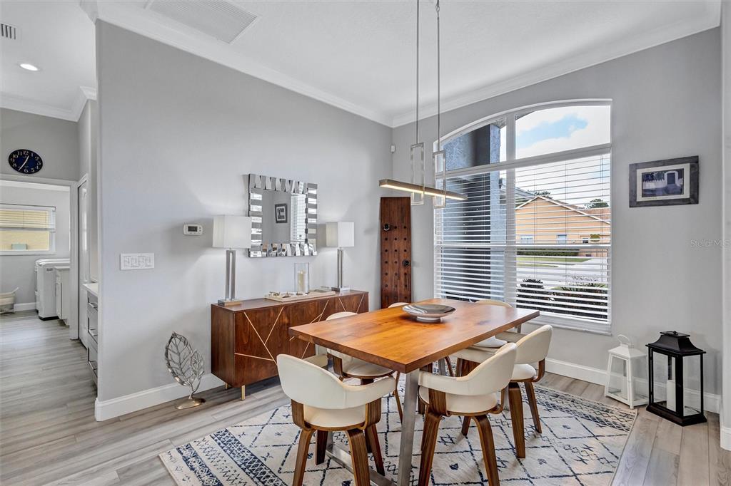 8409 29th Street East Parrish, FL 34219 - Photo 12 of 65 a view of a dining room with furniture