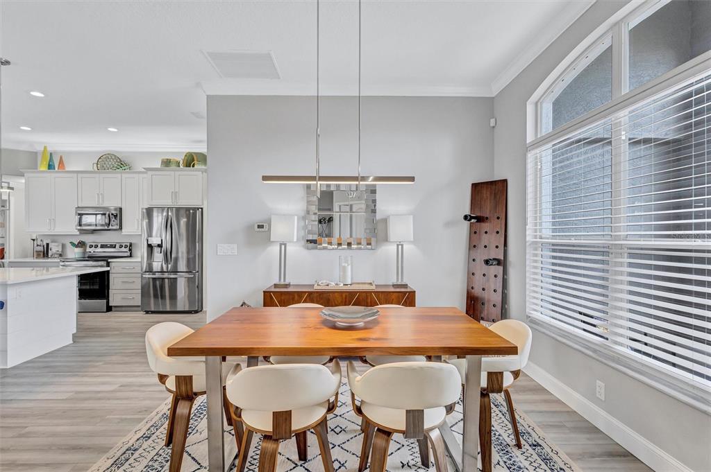 8409 29th Street East Parrish, FL 34219 - Photo 14 of 65 a view of a dining room with furniture