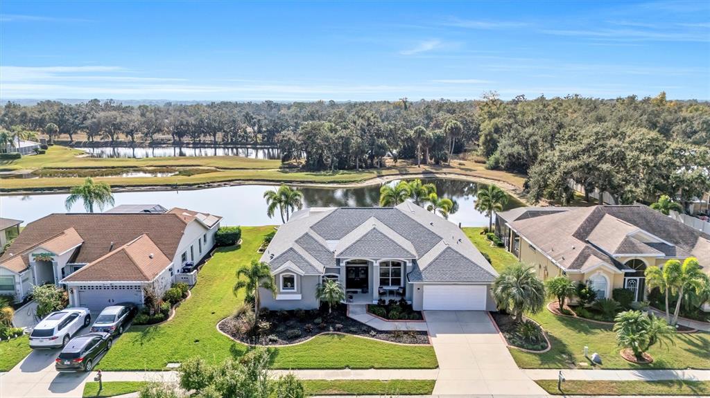 8409 29th Street East Parrish, FL 34219 - Photo 2 of 65 an aerial view of a house with outdoor space swimming pool and mountains