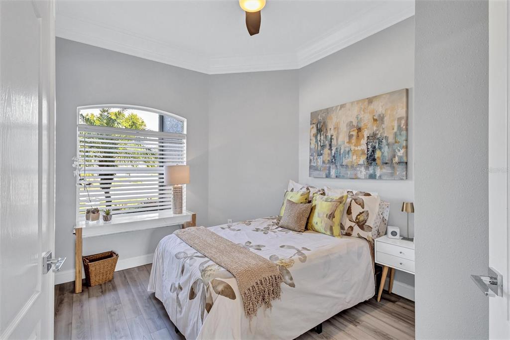 8409 29th Street East Parrish, FL 34219 - Photo 32 of 65 a bedroom with a bed and a window