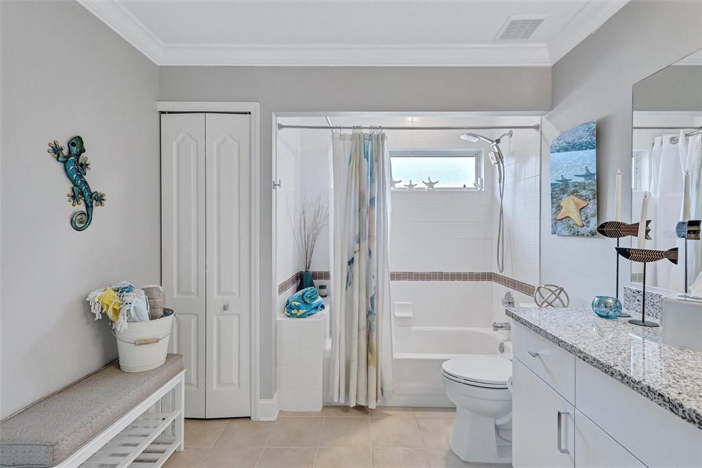 8409 29th Street East Parrish, FL 34219 - Photo 38 of 65 a bathroom with a granite countertop toilet and sink