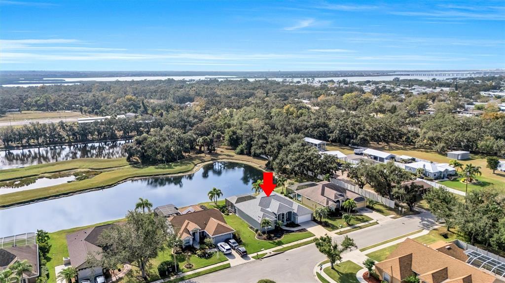 8409 29th Street East Parrish, FL 34219 - Photo 59 of 65 an aerial view of residential houses with outdoor space and swimming pool