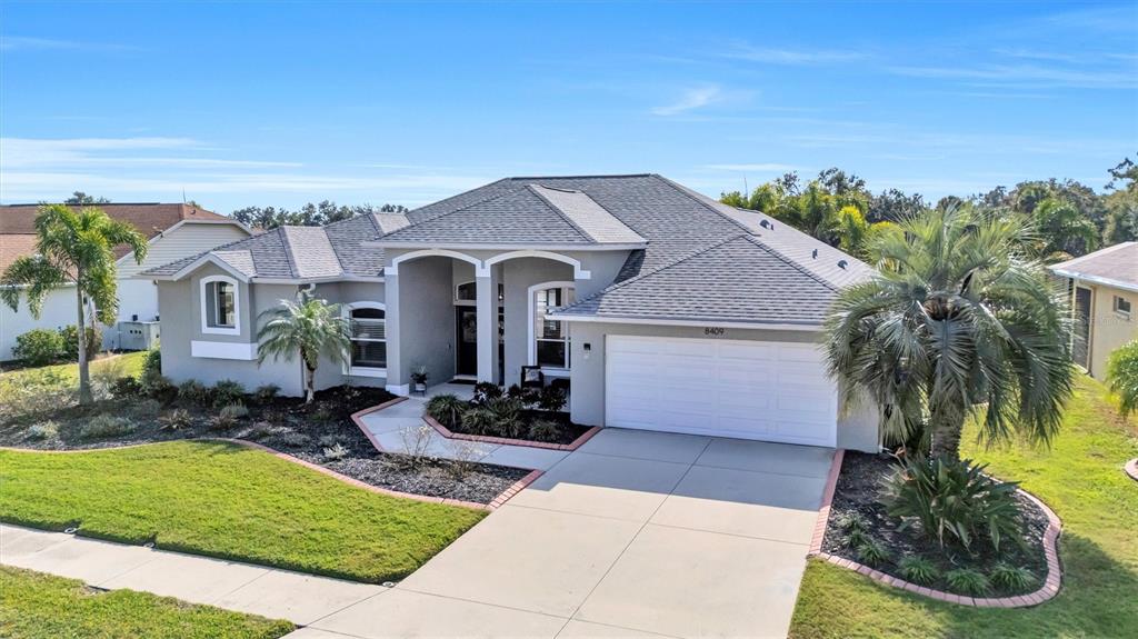 8409 29th Street East Parrish, FL 34219 - Photo 63 of 65 a front view of a house with garden