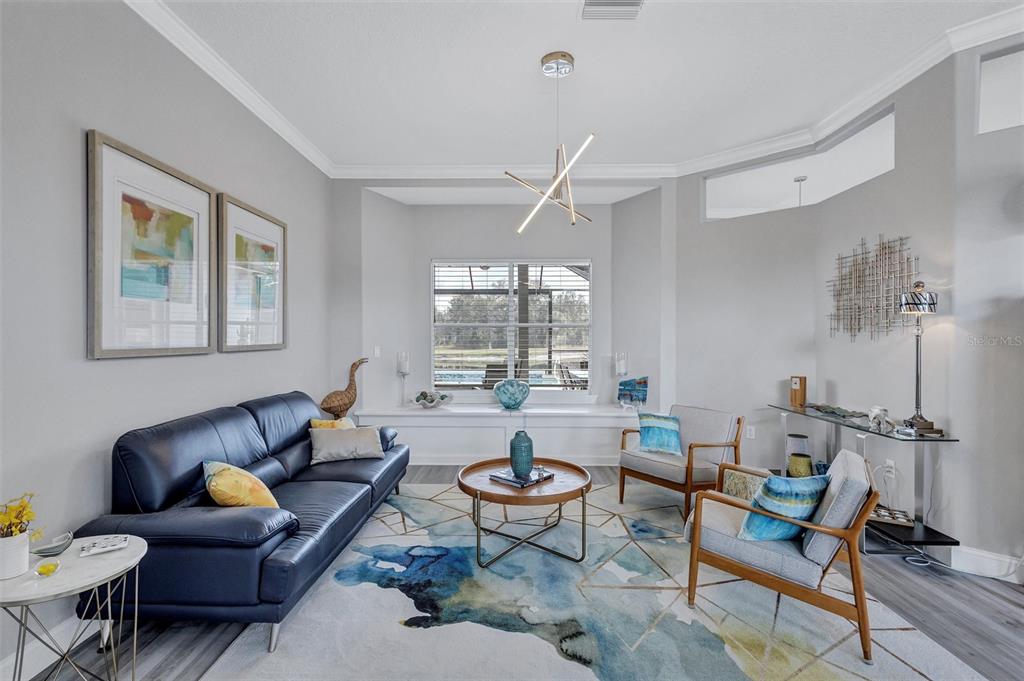 8409 29th Street East Parrish, FL 34219 - Photo 8 of 65 a living room with furniture and a large window