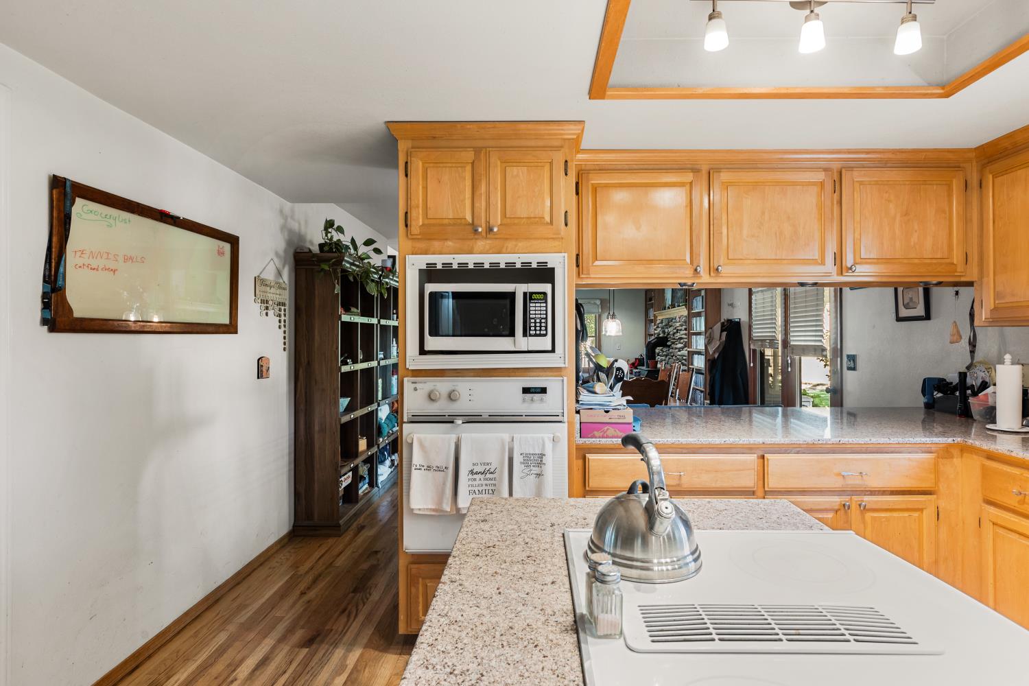 3206 Gillam Road Valley Springs, CA 95252 - Photo 11 of 44 a room with wooden floor and furniture
