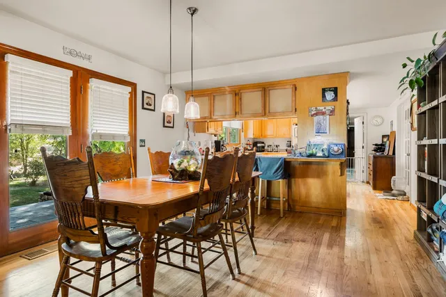 a dining room with furniture window wooden floor