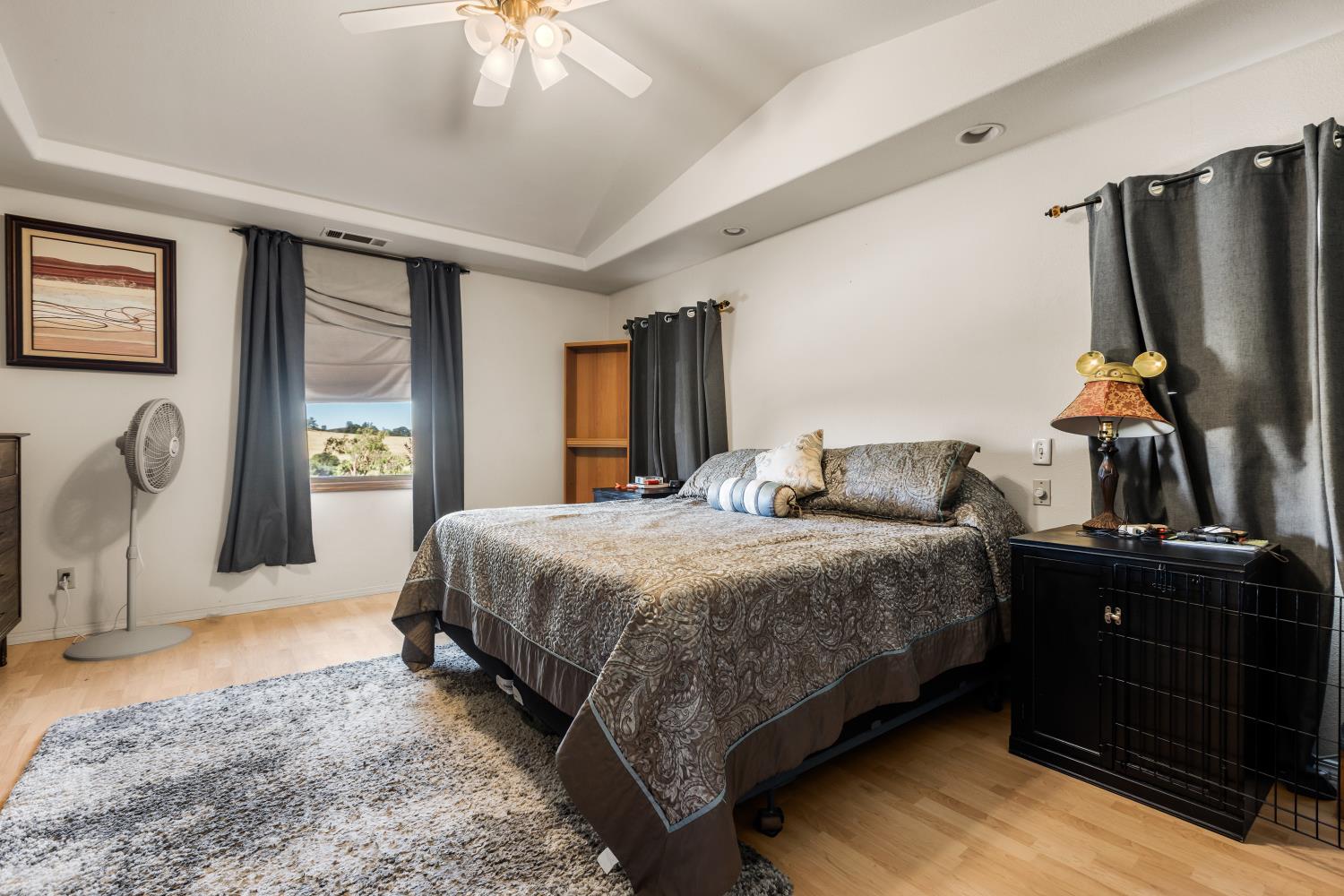 3206 Gillam Road Valley Springs, CA 95252 - Photo 15 of 44 a bedroom with a bed dresser and a flat tv screen