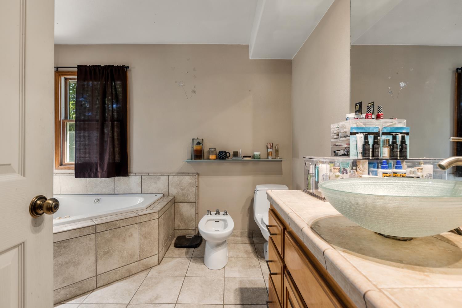 3206 Gillam Road Valley Springs, CA 95252 - Photo 16 of 44 a bathroom with a sink and a mirror