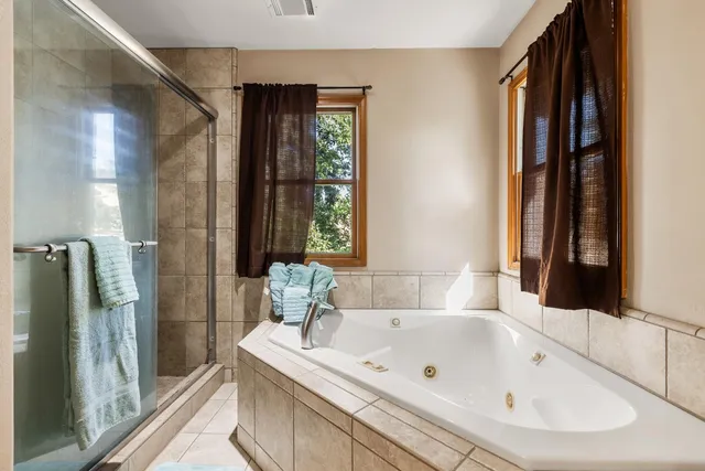 a bathroom with a bathtub and a sink