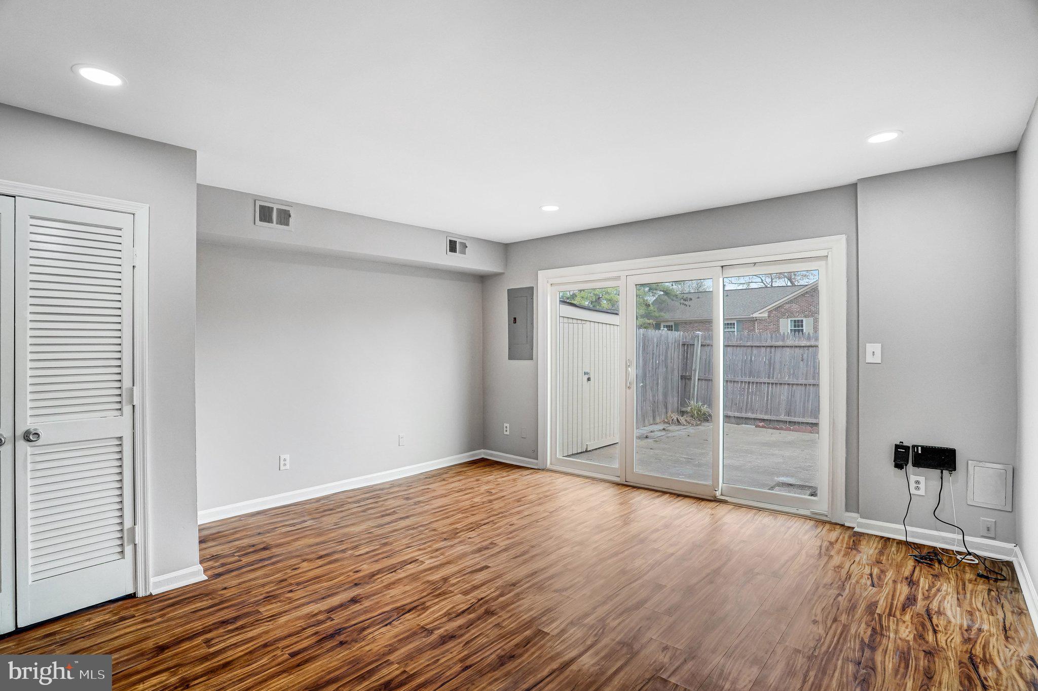 8396 Forrester Boulevard, Unit 555 Springfield, VA 22152 - Photo 11 of 24 wooden floor in an empty room with a window