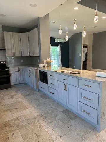 a large kitchen with cabinets