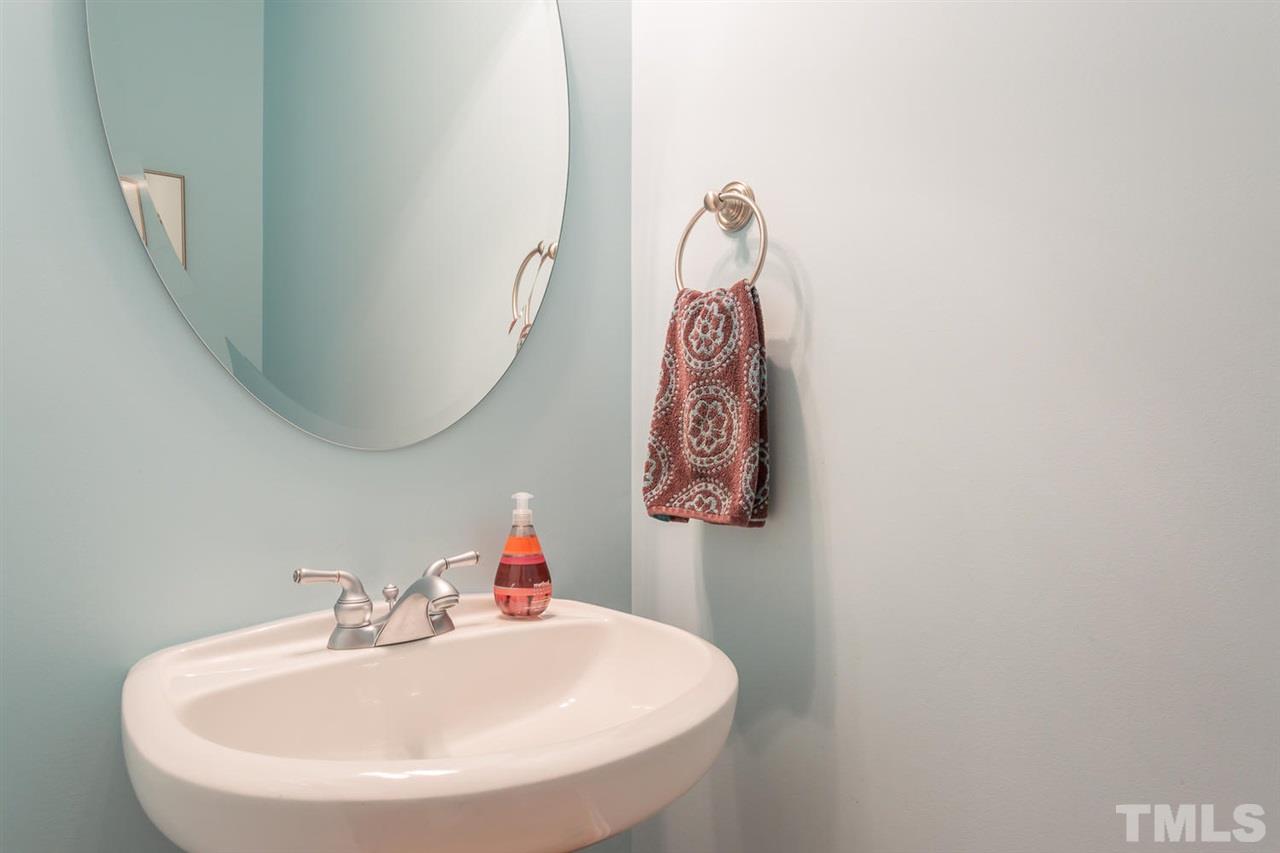 8609 Benzinger Drive Raleigh, NC 27613 - Photo 14 of 25 a bathroom with a sink and mirror