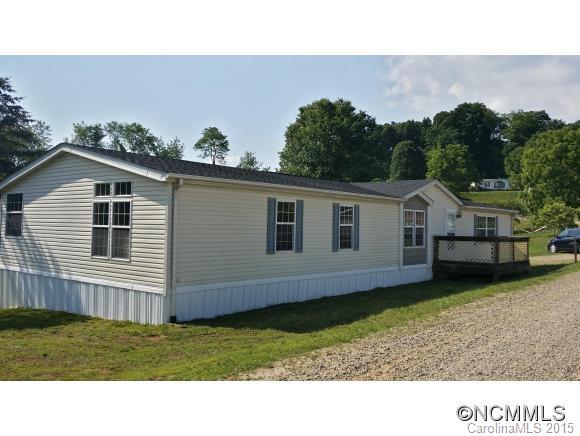 91 Austin Road Clyde, NC 28721 - Photo 4 of 23 a house view with a backyard space