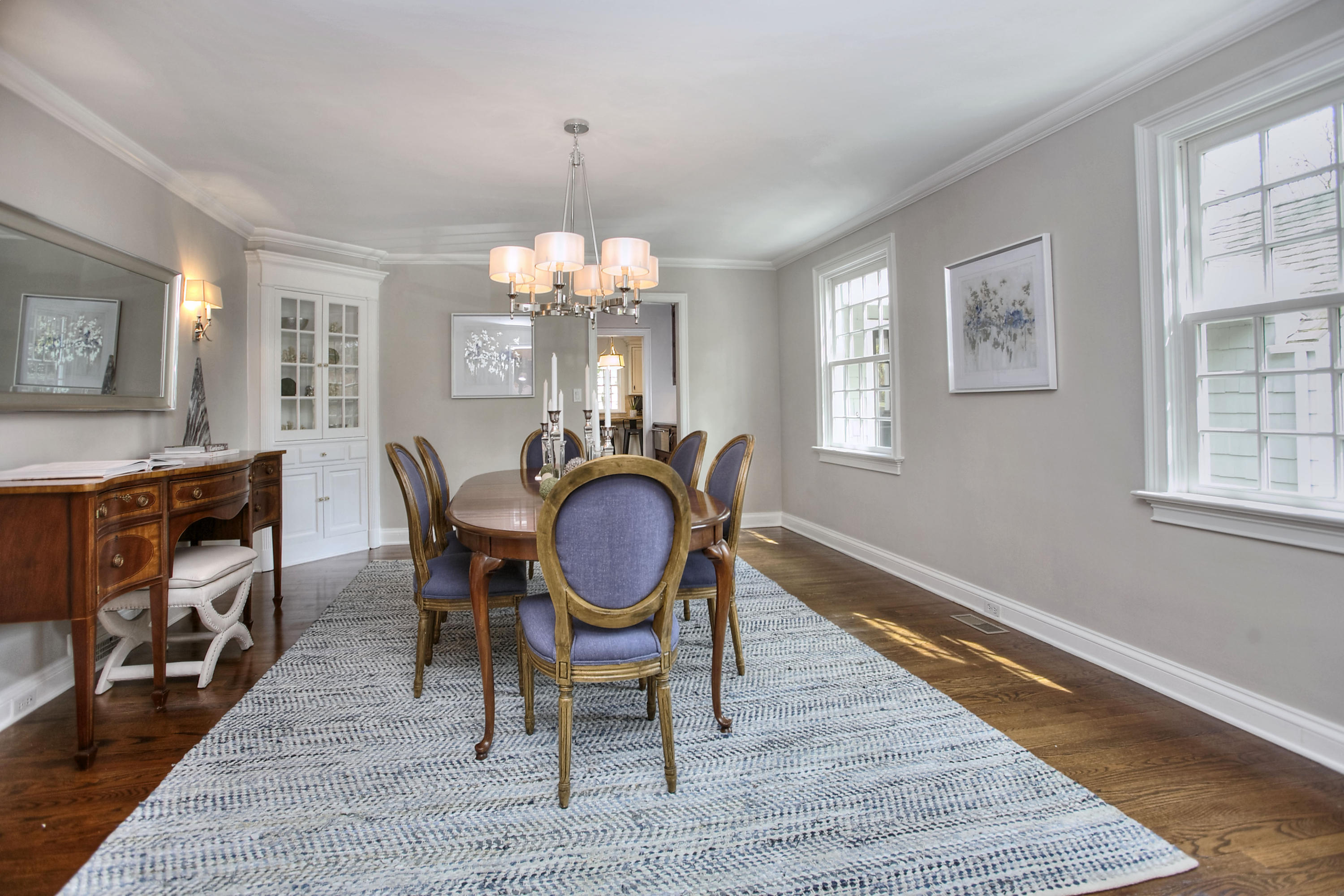 25 Point O Woods Road Darien, CT 06820 - Photo 12 of 68 a view of a dining room with furniture a chandelier and wooden floor