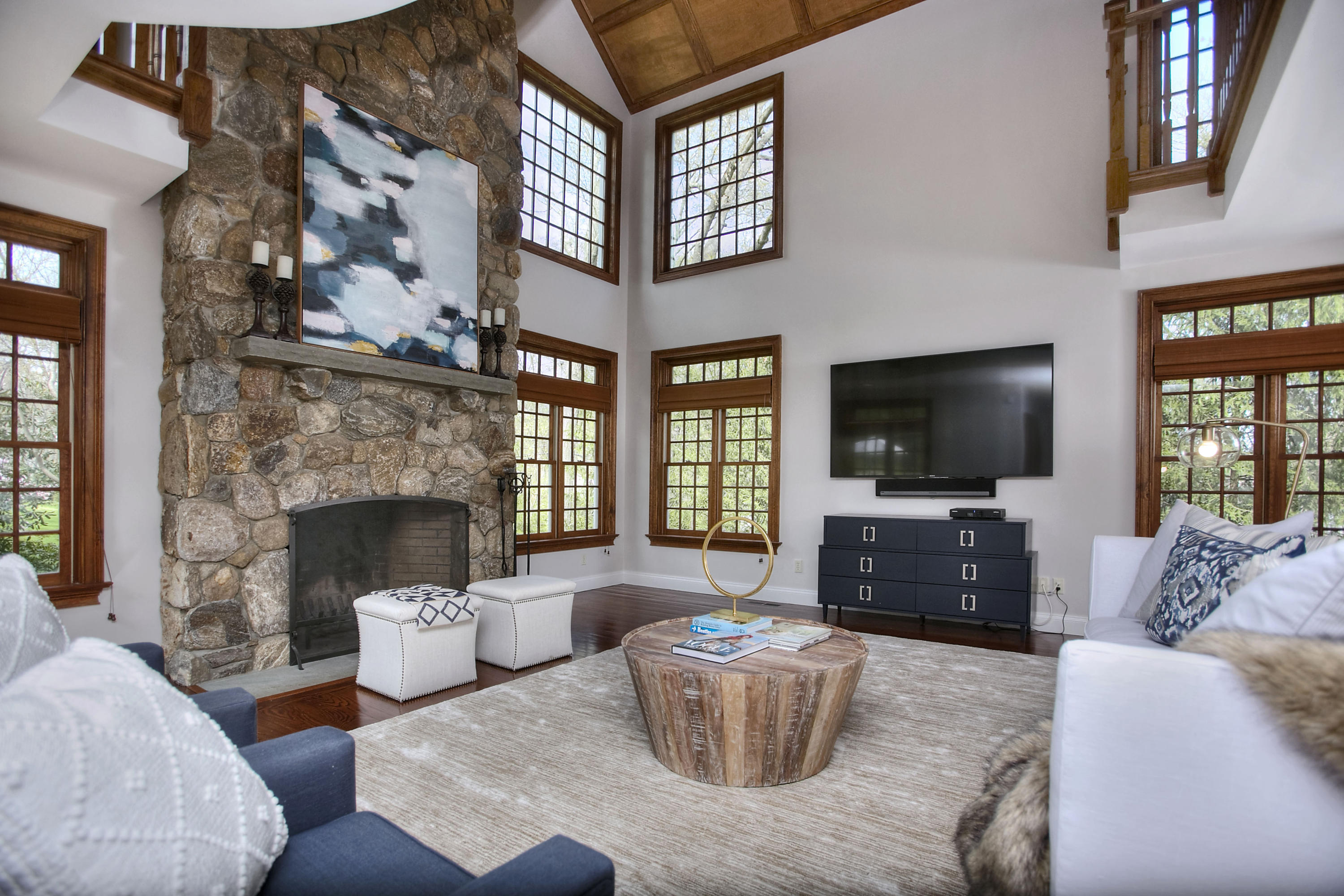 25 Point O Woods Road Darien, CT 06820 - Photo 15 of 68 a living room with furniture a flat screen tv and a fireplace