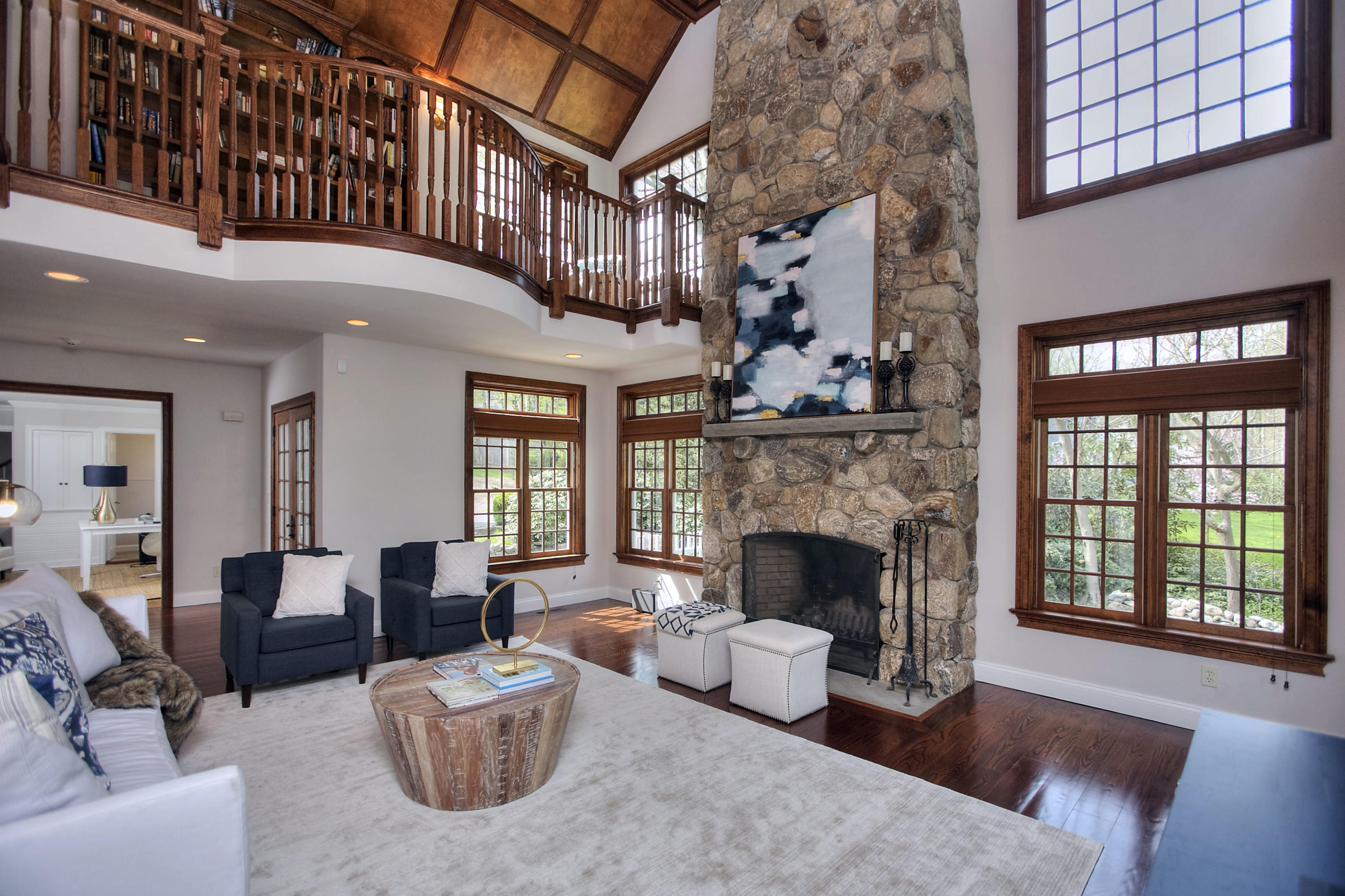 25 Point O Woods Road Darien, CT 06820 - Photo 16 of 68 a living room with furniture a fireplace and a large window