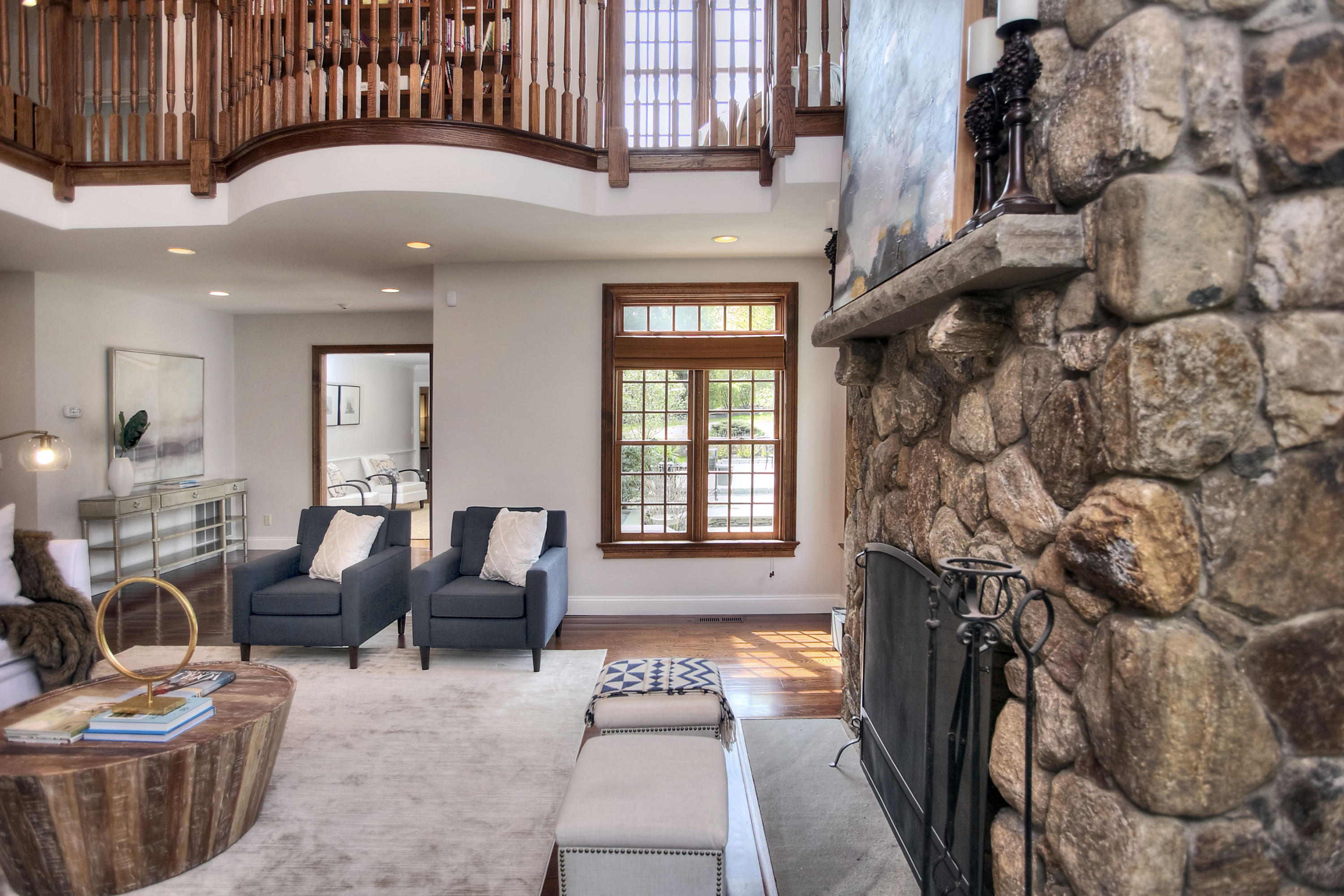 25 Point O Woods Road Darien, CT 06820 - Photo 18 of 68 a living room with furniture and a fireplace