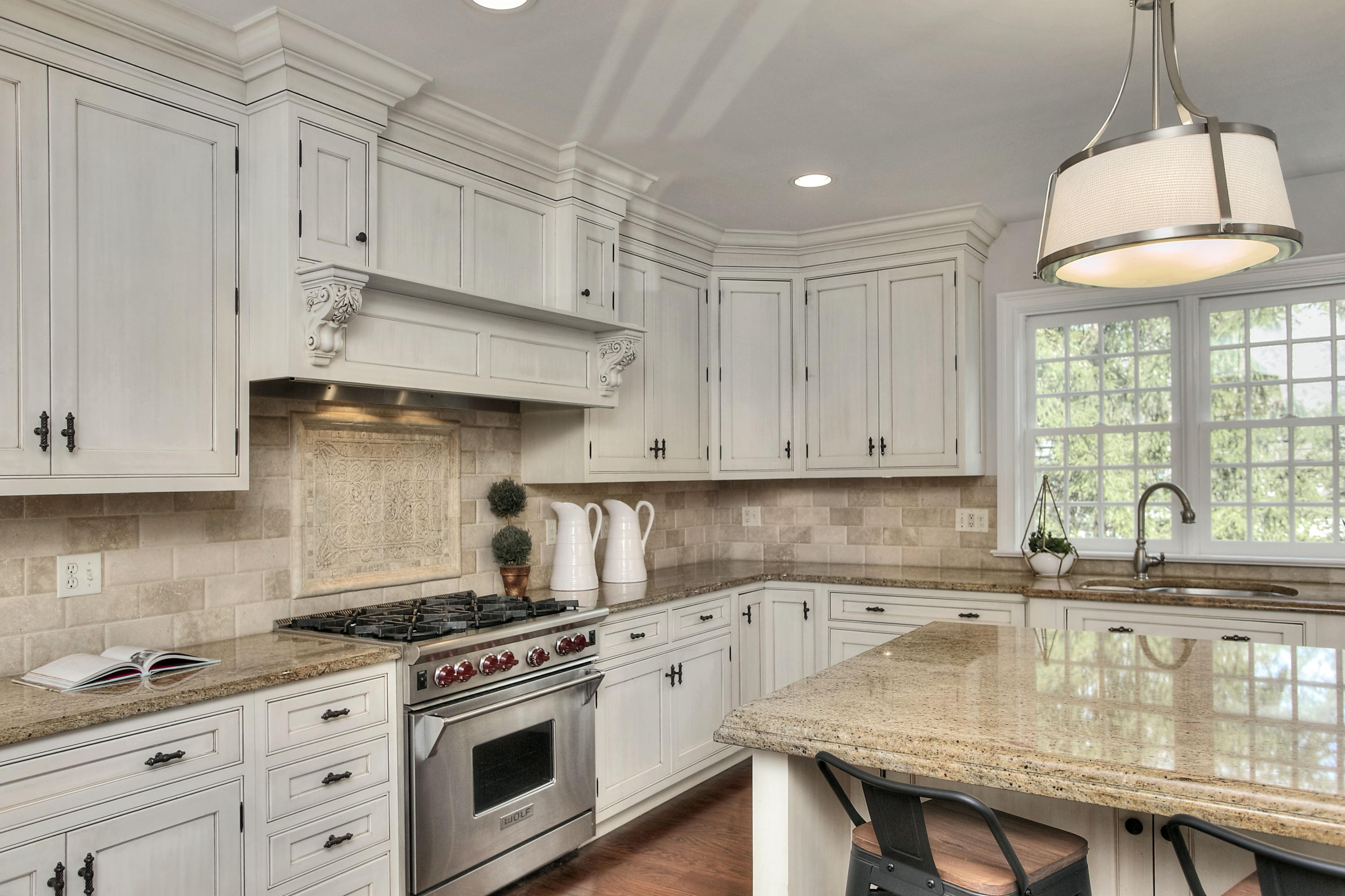 25 Point O Woods Road Darien, CT 06820 - Photo 24 of 68 a kitchen with stainless steel appliances granite countertop a sink a stove and a white cabinets