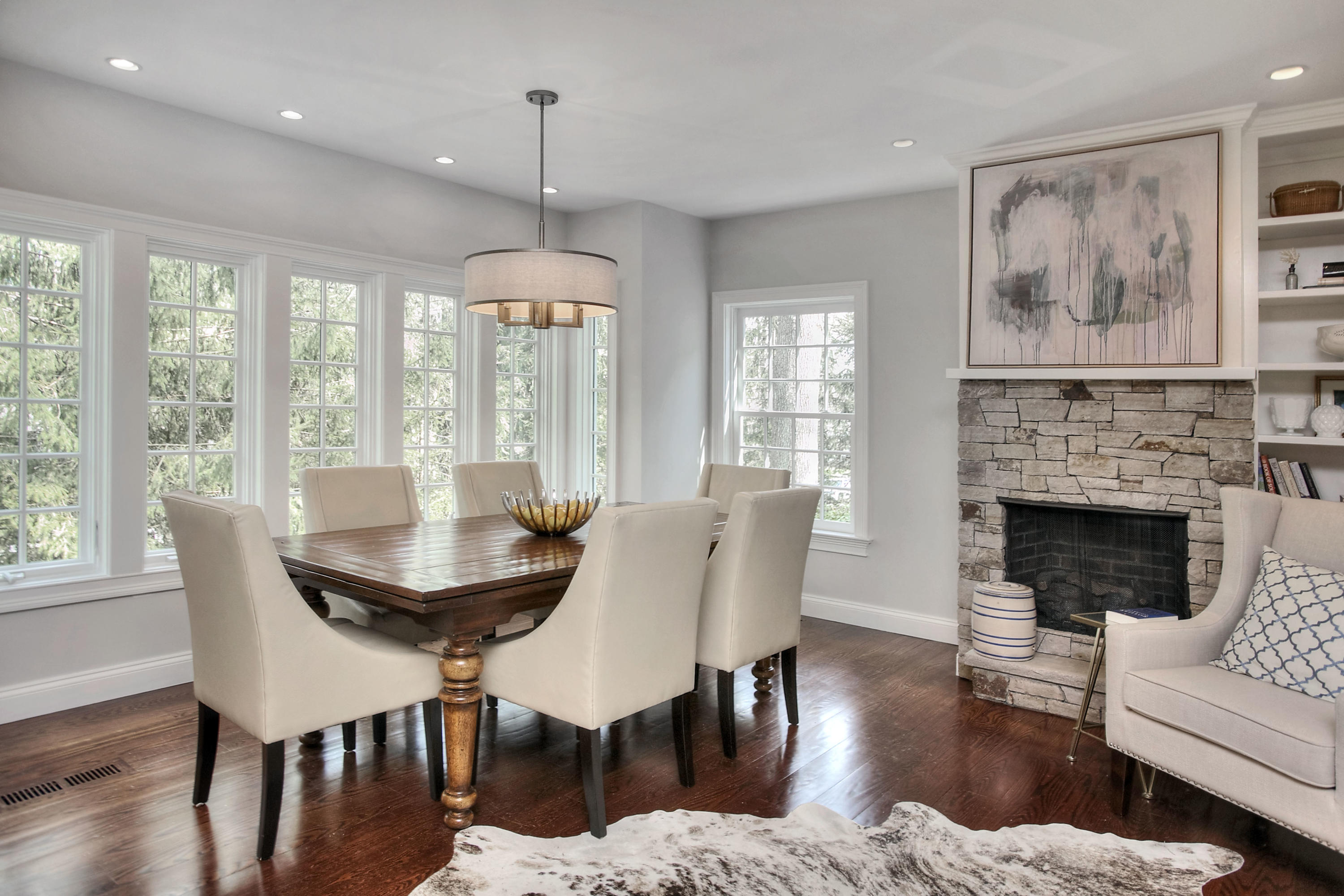 25 Point O Woods Road Darien, CT 06820 - Photo 28 of 68 a dining room with furniture a chandelier and wooden floor