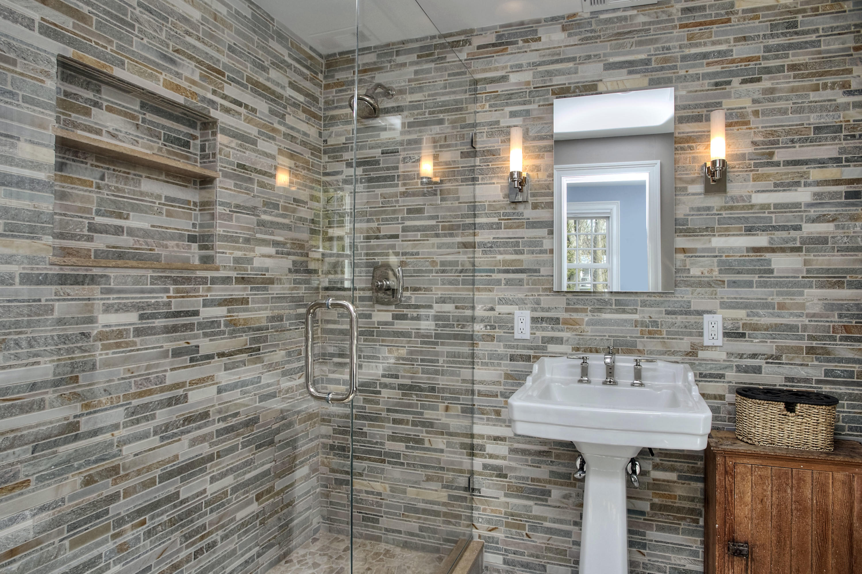 25 Point O Woods Road Darien, CT 06820 - Photo 35 of 68 a bathroom with a sink and a mirror