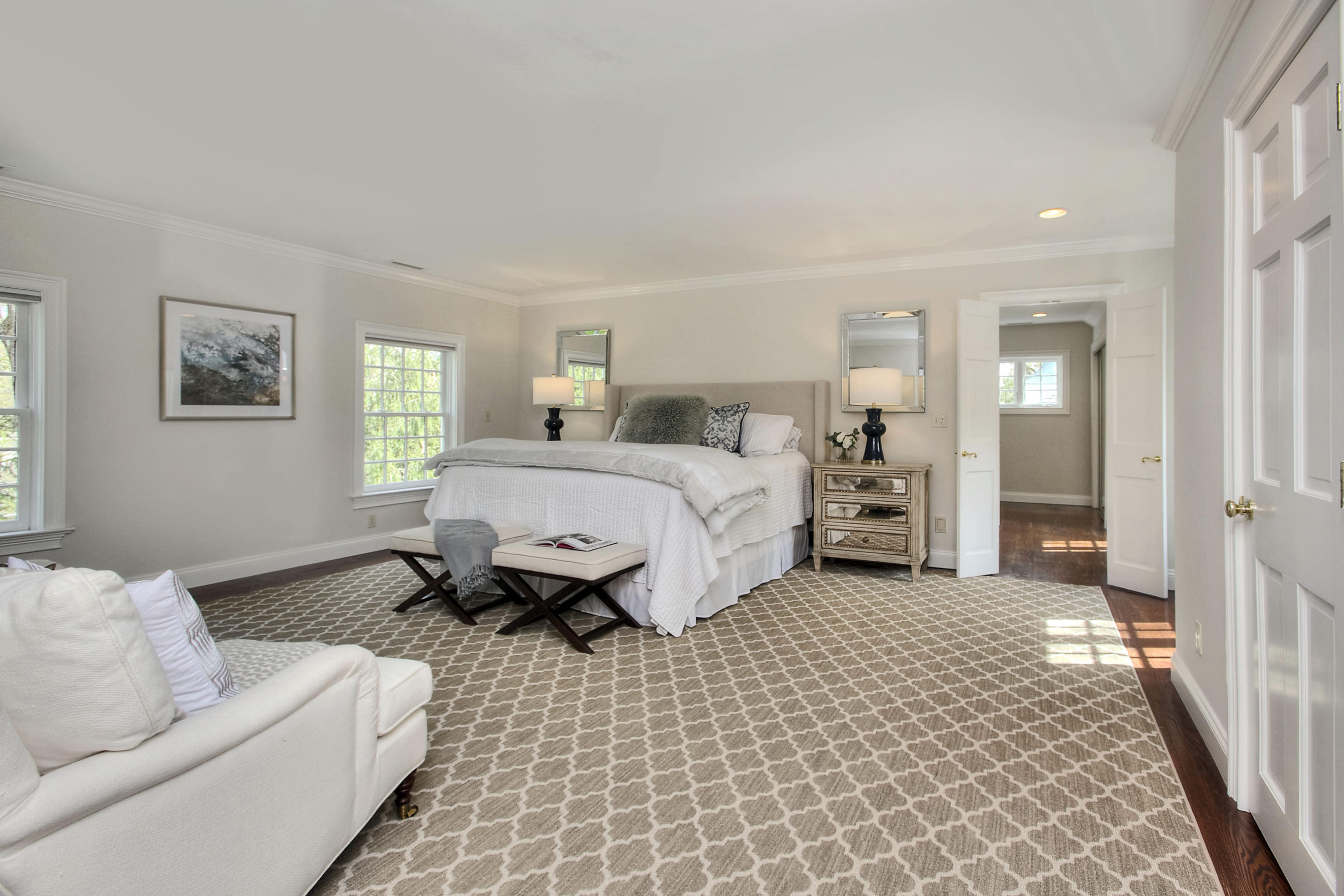 25 Point O Woods Road Darien, CT 06820 - Photo 42 of 68 a spacious bedroom with a bed and a couch