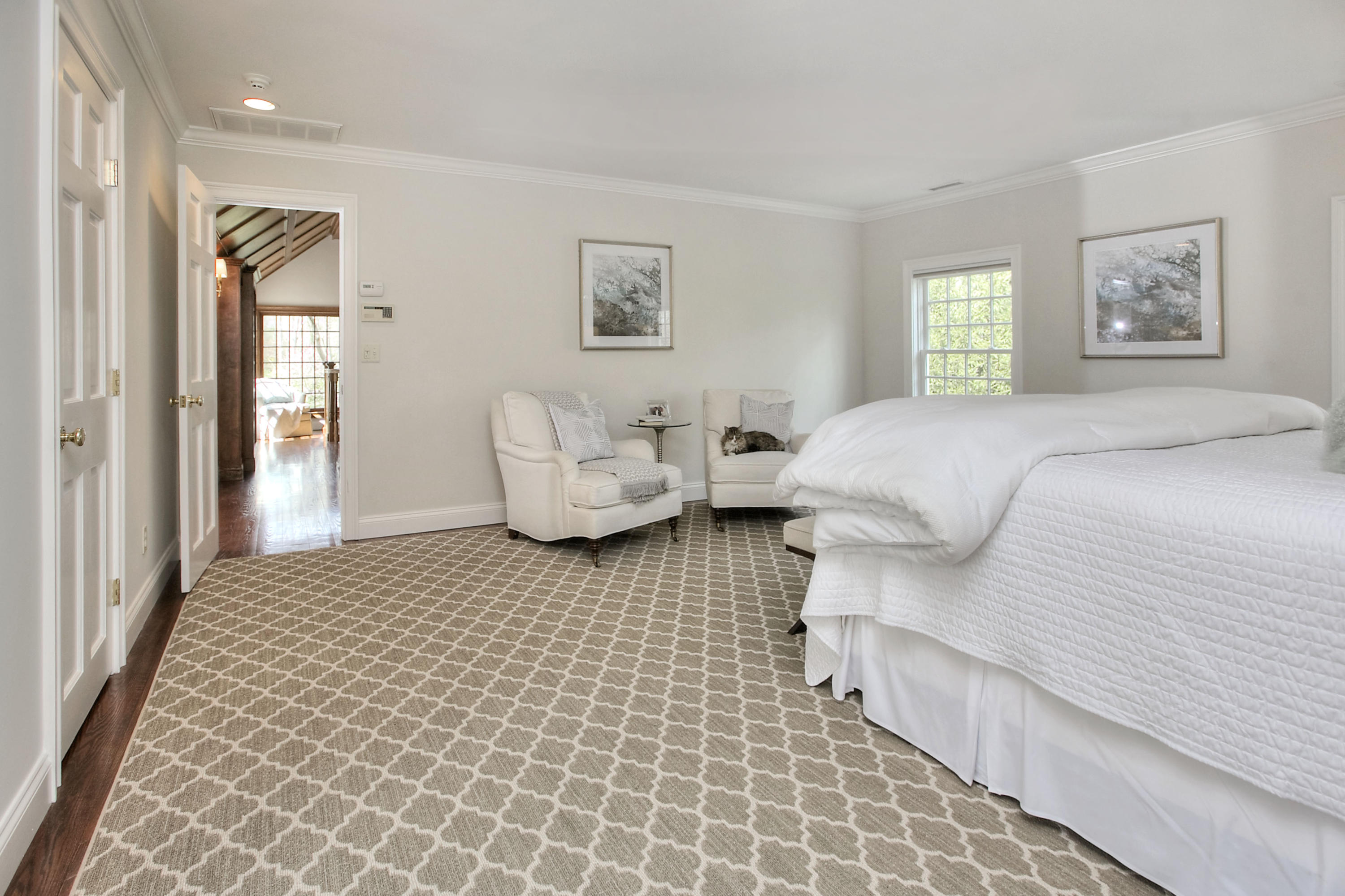 25 Point O Woods Road Darien, CT 06820 - Photo 43 of 68 a bedroom with a bed and a couch