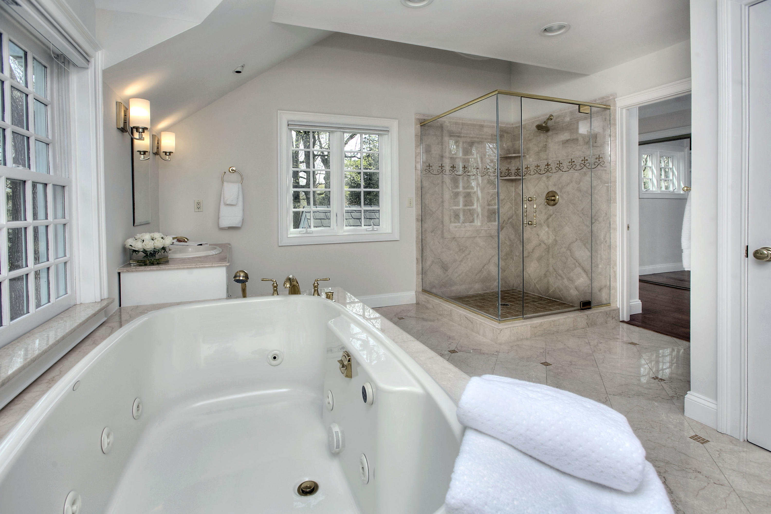 25 Point O Woods Road Darien, CT 06820 - Photo 47 of 68 a bathroom with a granite countertop sink a toilet and shower