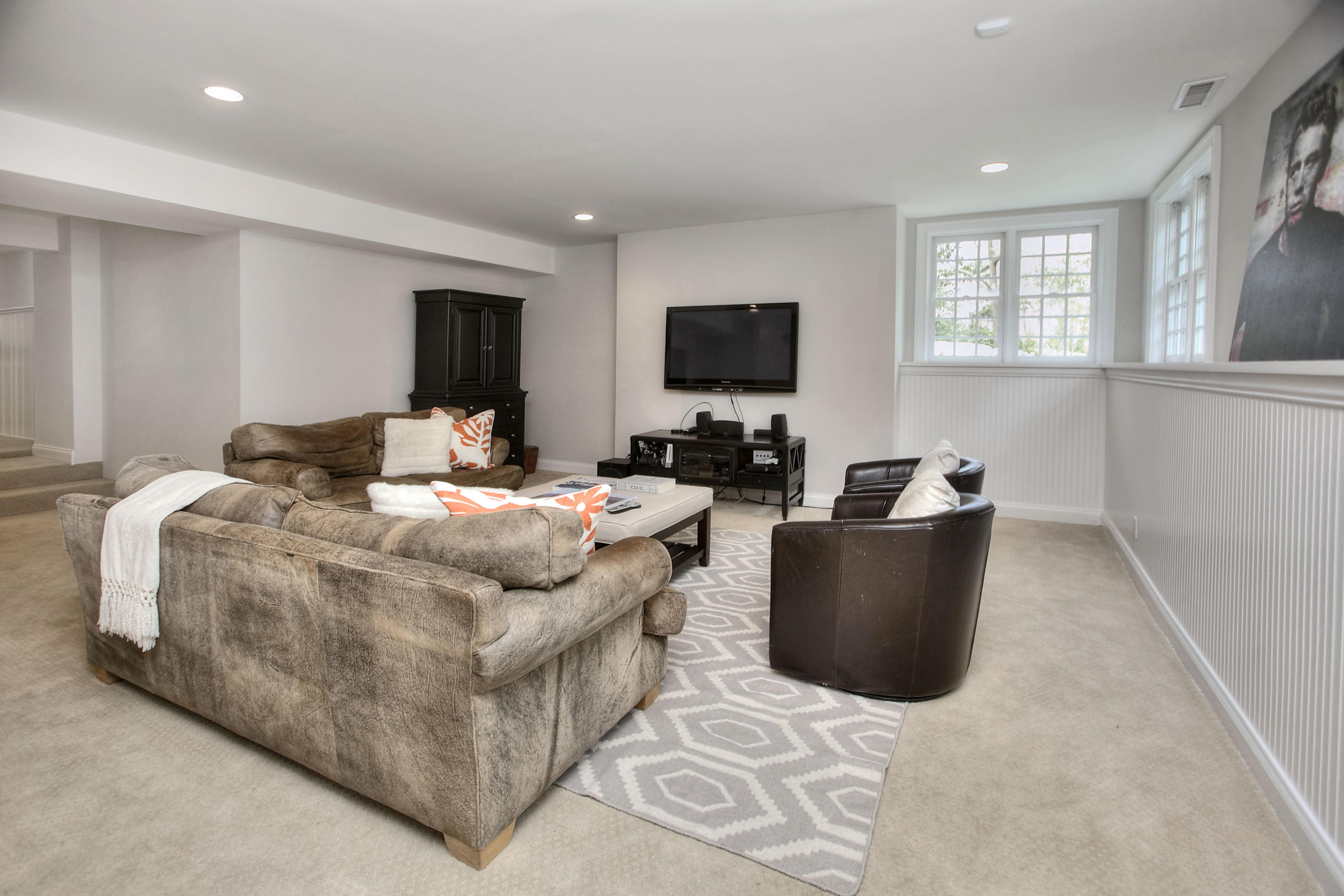 25 Point O Woods Road Darien, CT 06820 - Photo 53 of 68 a bedroom with a bed and a flat screen tv