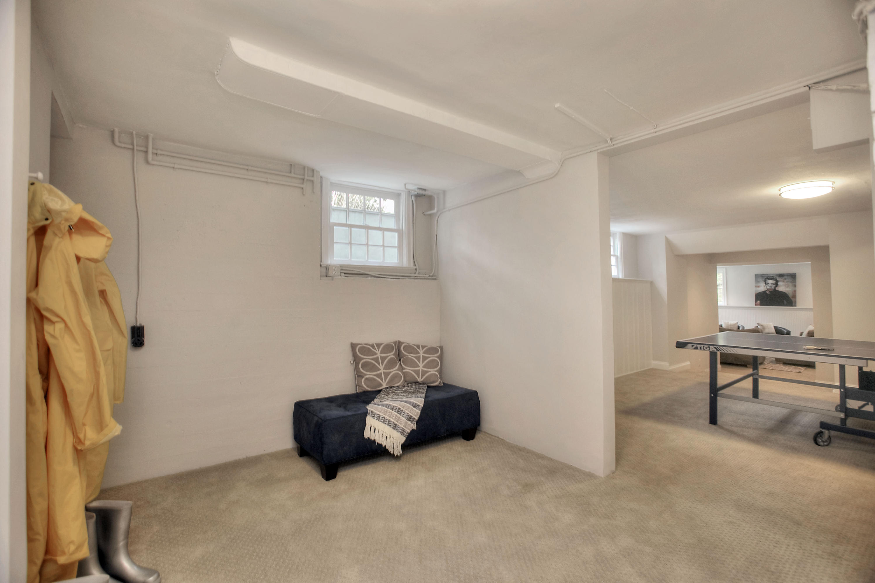 25 Point O Woods Road Darien, CT 06820 - Photo 60 of 68 a living room with furniture and a flat screen tv