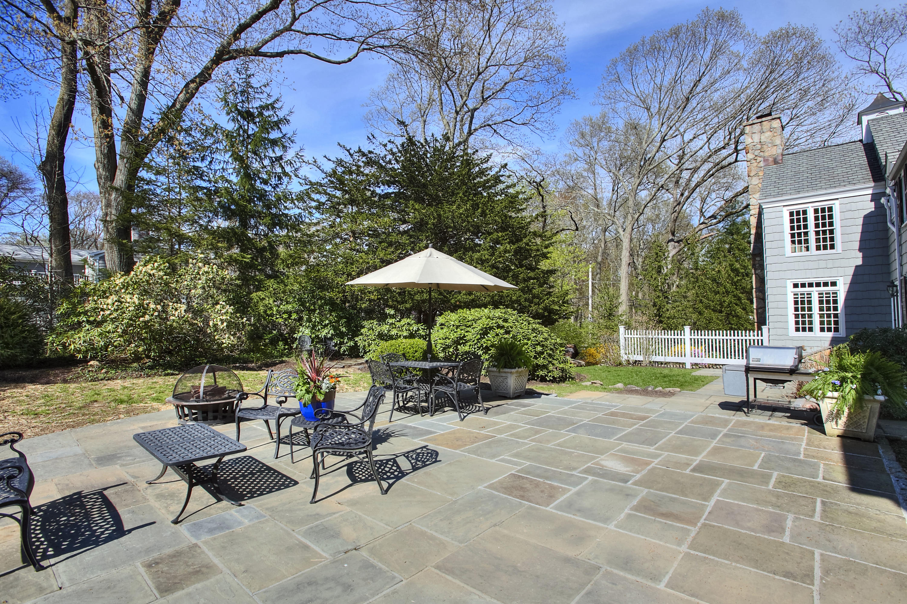 25 Point O Woods Road Darien, CT 06820 - Photo 65 of 68 a view of a backyard with sitting area and furniture