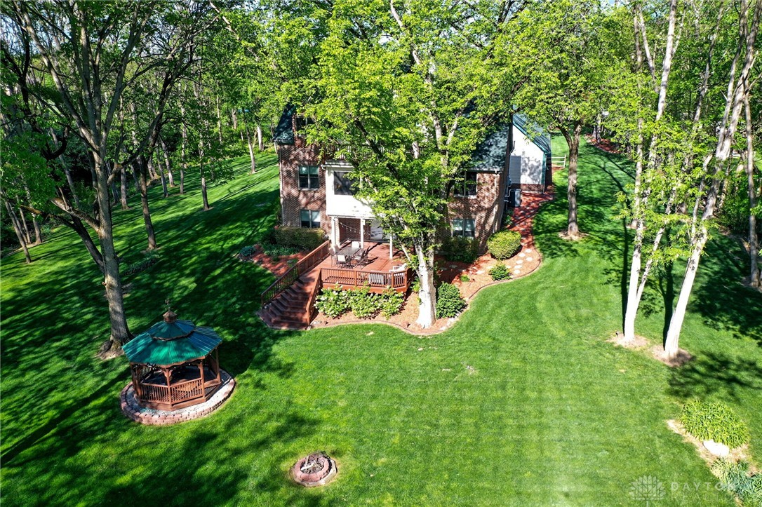 330 South Alpha Bellbrook Road Bellbrook, OH 45305 - Photo 74 of 87 This verdant property features a charming gazebo and a spacious deck, perfect for outdoor living.