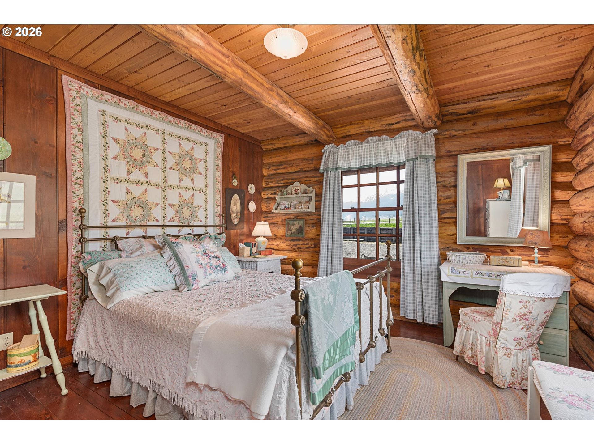 64782 Alder Slope Road Enterprise, OR 97828 - Photo 13 of 48 a bedroom with furniture and a large window