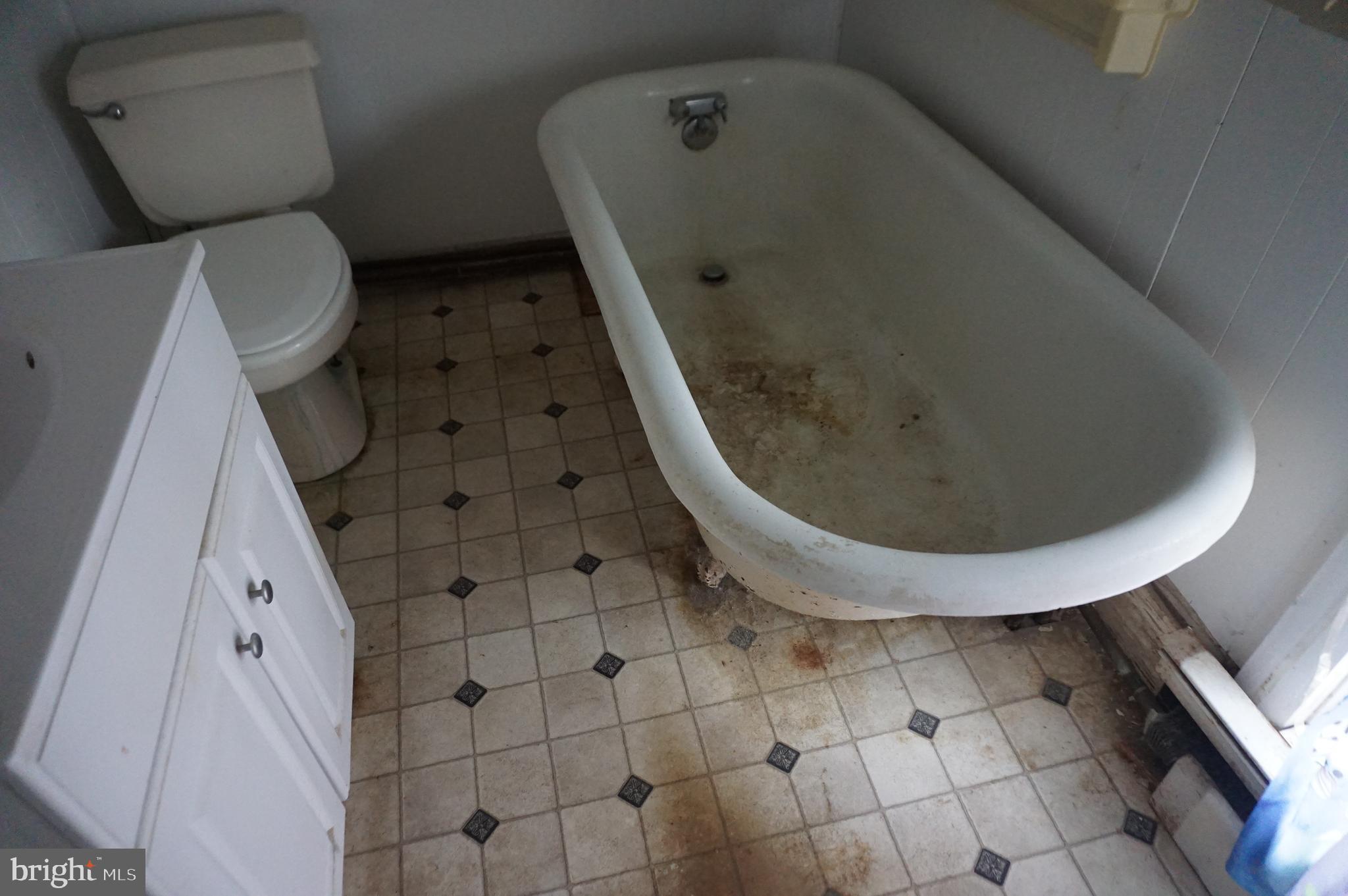 103 Chambers Street Preston, MD 21655 - Photo 12 of 12 a bathroom with a toilet and a tub