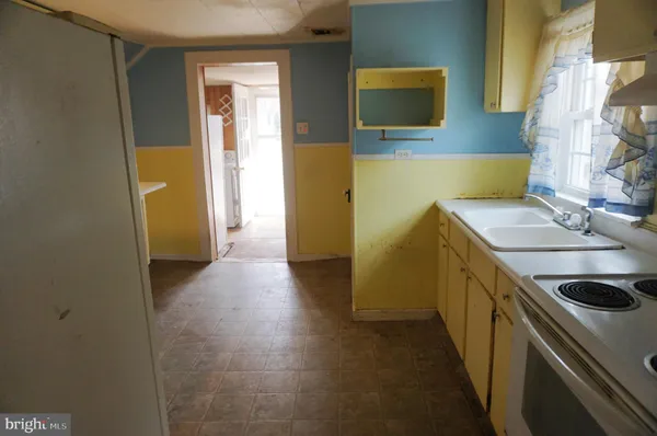 a bathroom with a sink and a washing machine