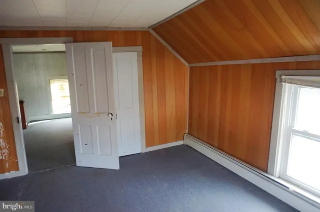 a view of empty room with windows