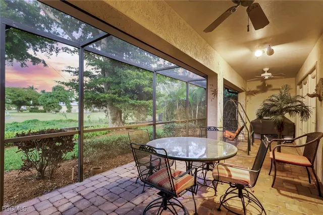 a view of a porch with furniture and yard