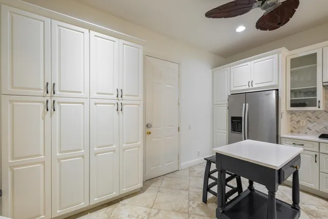 a view of kitchen with furniture and wooden floor
