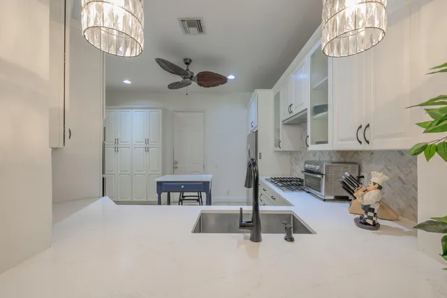 a very nice looking room with kitchen view