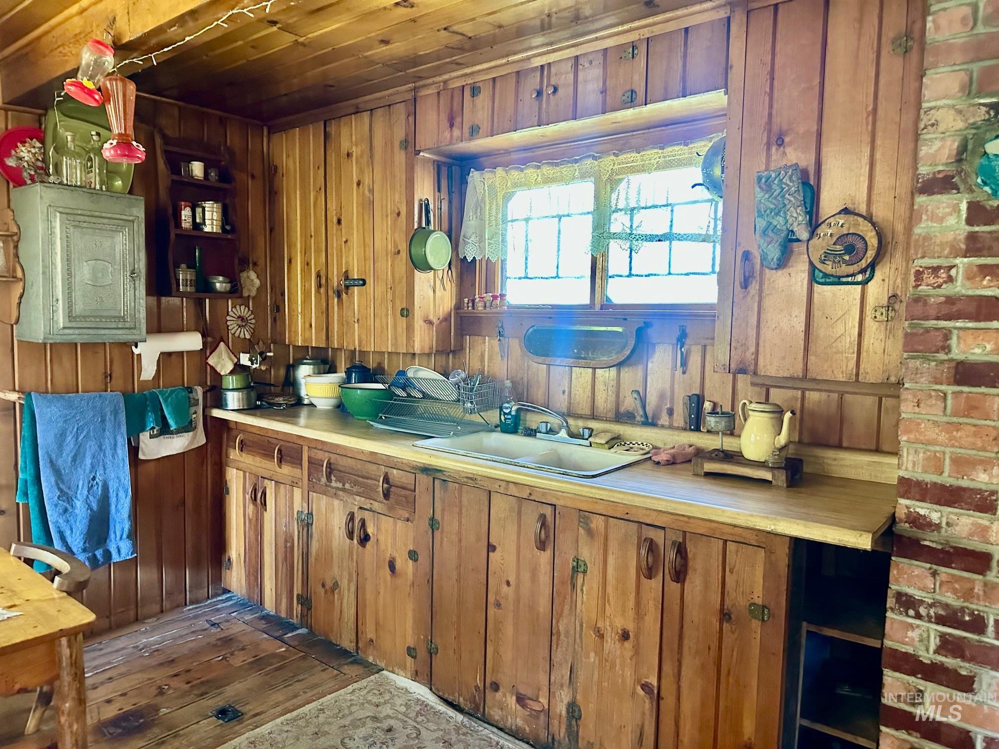 509 Deadline Road, Unit 2 Twin Falls, ID 83301 - Photo 10 of 28 Natural wood paneling throughout, featuring extensive wood cabinetry with metal hardware