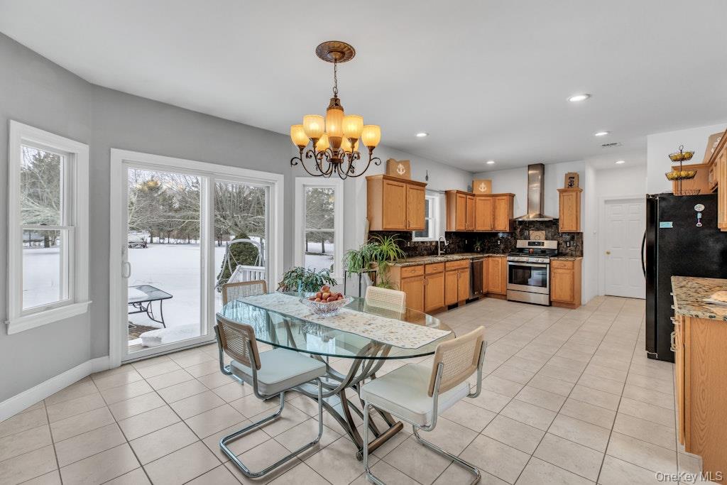 2655 Rocky Point Road East Marion, NY 11939 - Photo 12 of 50 Open kitchen with access to rear patio