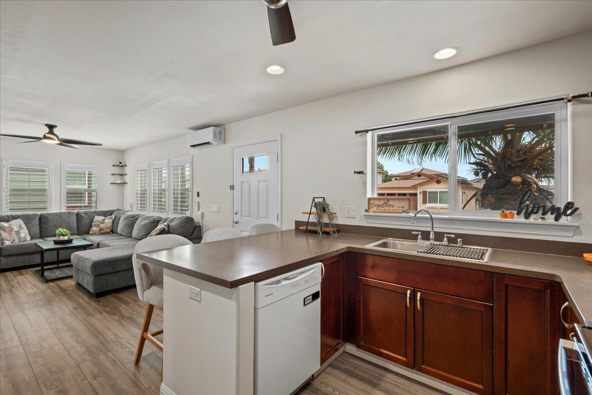 214 Alake Street Kahului, HI 96732 - Photo 17 of 27 a kitchen with a sink stove and cabinets