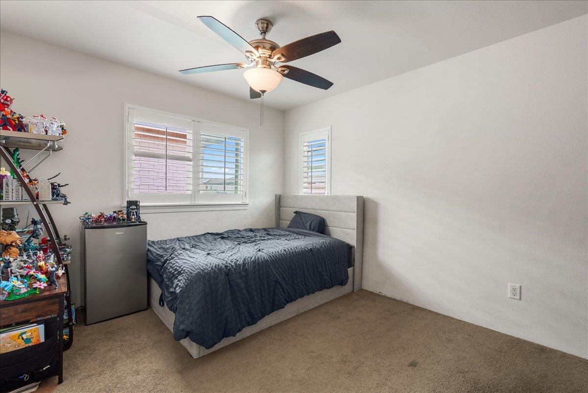 214 Alake Street Kahului, HI 96732 - Photo 22 of 27 a bed sitting in a bedroom next to a window