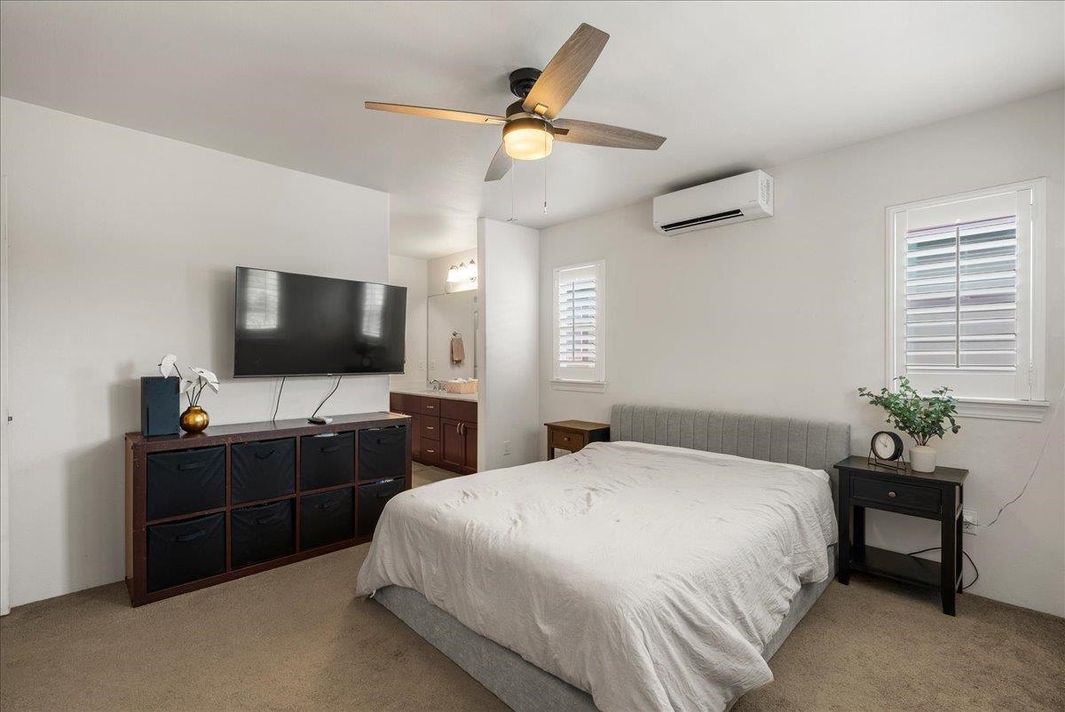 214 Alake Street Kahului, HI 96732 - Photo 27 of 27 a bedroom with a bed and a flat screen tv