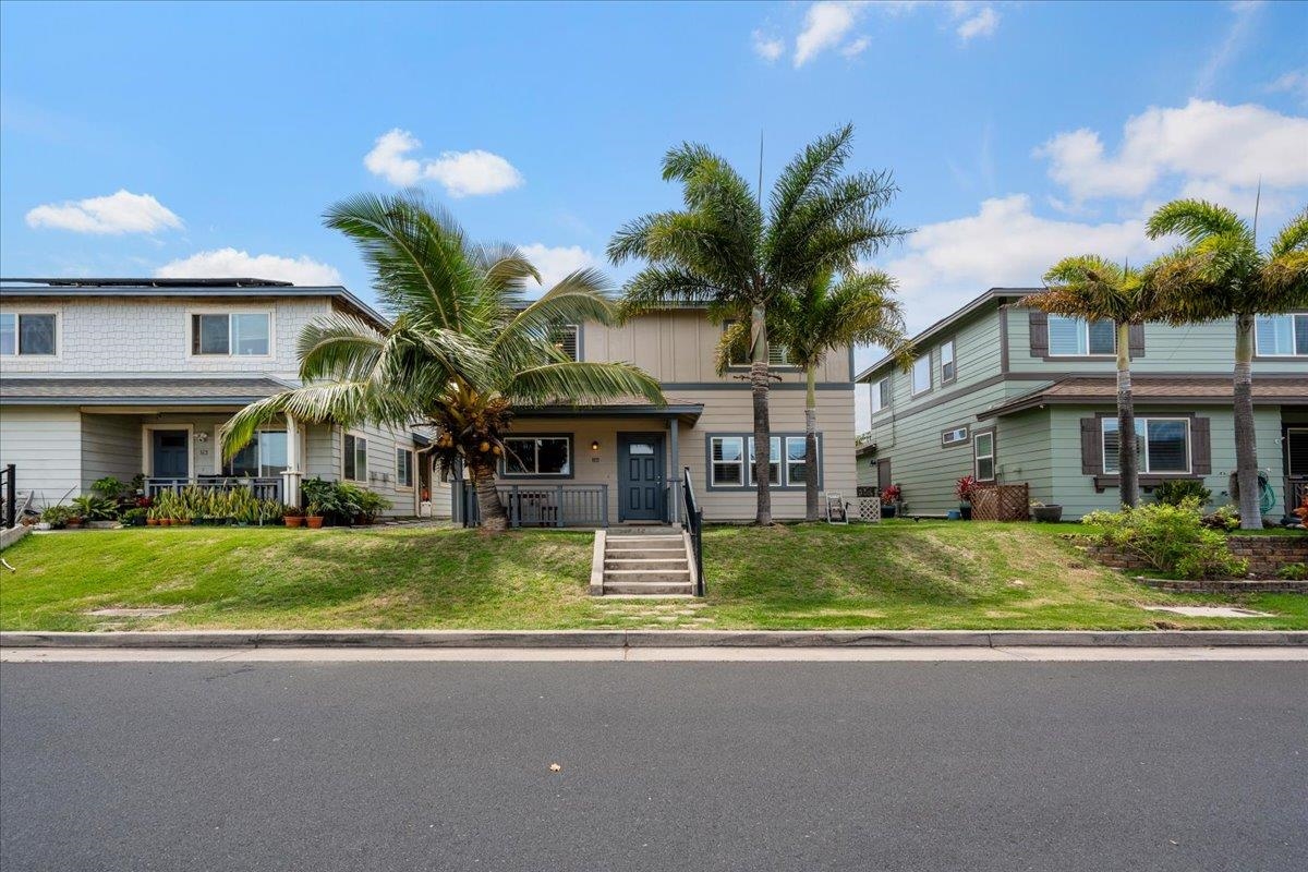 214 Alake Street Kahului, HI 96732 - Photo 3 of 27 a front view of a house with garden and porch