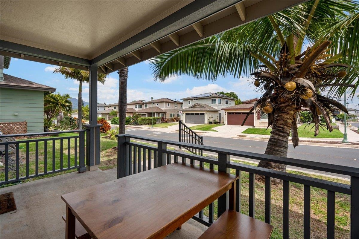 214 Alake Street Kahului, HI 96732 - Photo 7 of 27 a balcony with wooden floor table and chairs