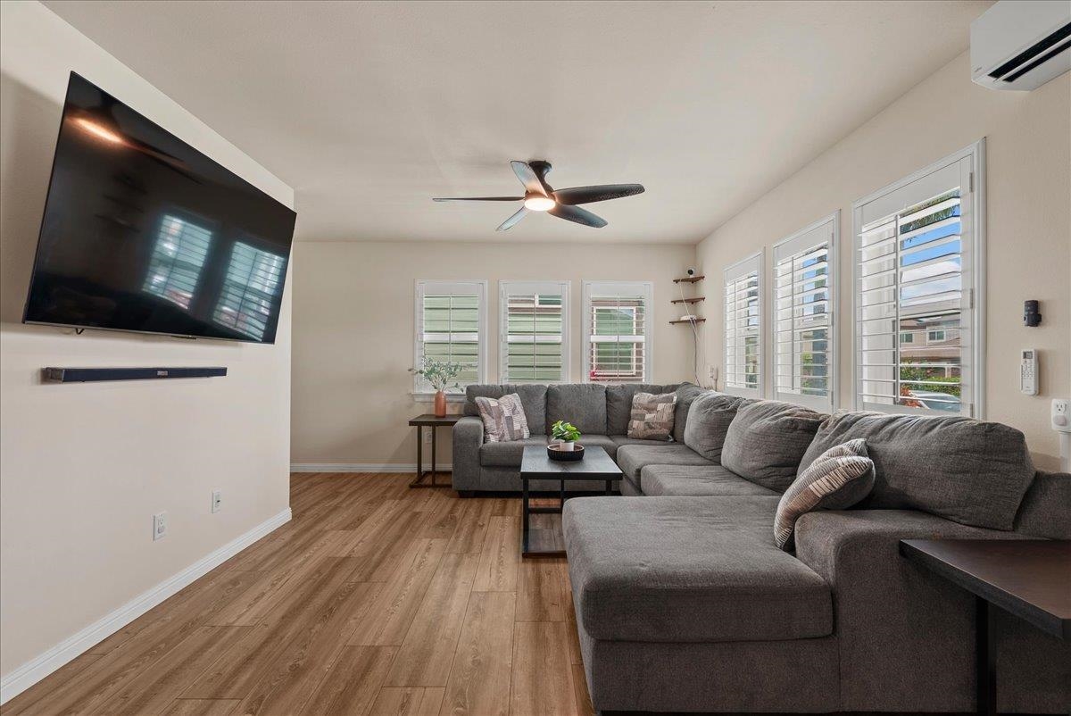 214 Alake Street Kahului, HI 96732 - Photo 9 of 27 a living room with furniture a flat screen tv and a large window