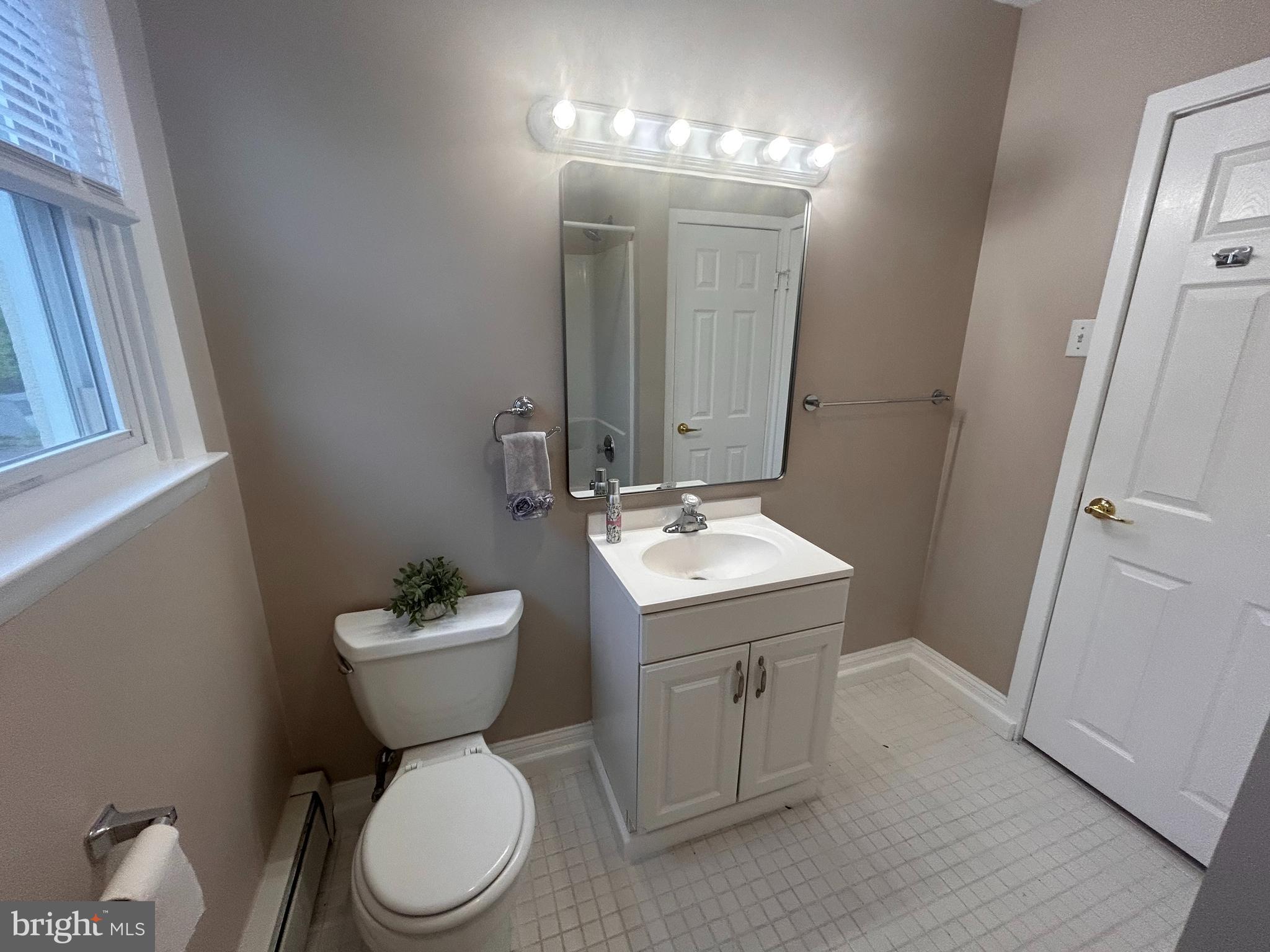 300 Evesham Avenue West Magnolia, NJ 08049 - Photo 16 of 25 a bathroom with a toilet sink and mirror